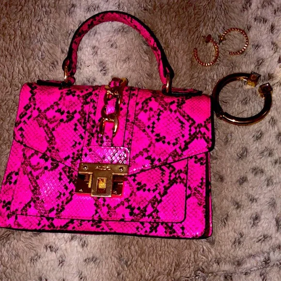 Pink and black reptile purse